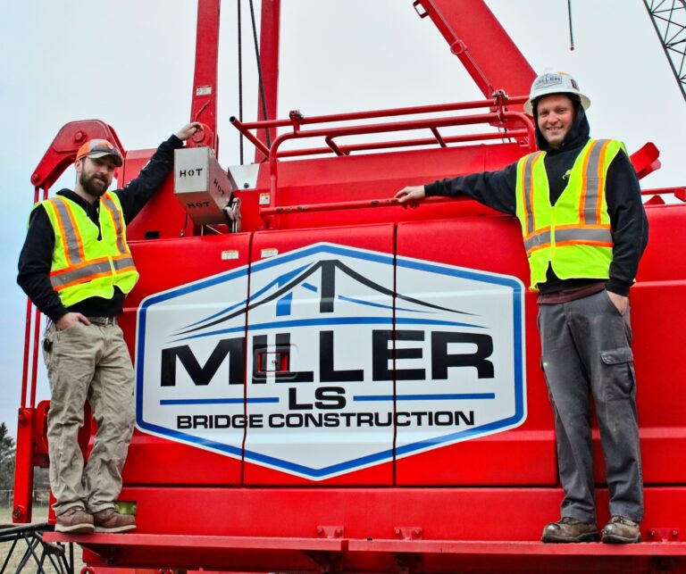 Two Miller Bridge Cosntrucction employees with a crane.